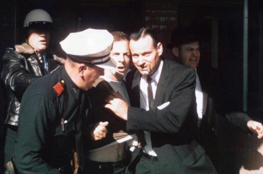 Oswald being led from the Texas Theatre following his arrest