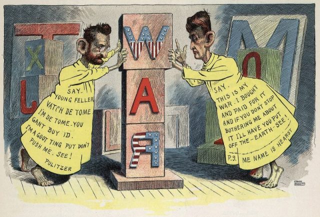 Editorial cartoon by Leon Barritt. Newspaper publishers Joseph Pulitzer and William Randolph Hearst, full-length dressed as the “Yellow Kid” (a popular cartoon character of the day), each pushing against opposite sides of a pillar of wooden blocks that spells WAR. This is a satire of the Pulitzer and Hearst newspapers’ role in rousing public opinion for war with Spain. First published 29 June 1898.