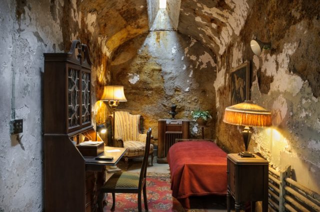 “Al Capone’s prison cell with personal furnishings during his stay at Eastern State Penitentiary, Philadelphia, PA, USA.”