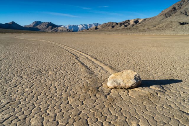 The Racetrack Playa, or The Racetrack, is a scenic dry lake feature with “sailing stones” that inscribe linear “racetrack” imprints. It is located above the northwestern side of Death Valley, in Death Valley National Park, Inyo County, California, U.S.