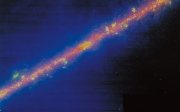 A view from the Infrared Astronomical Satellite of nearly the entire heavens in false color.