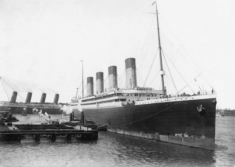 Olympic arriving at port on maiden voyage June 1911, with Lusitania departing in the background.
