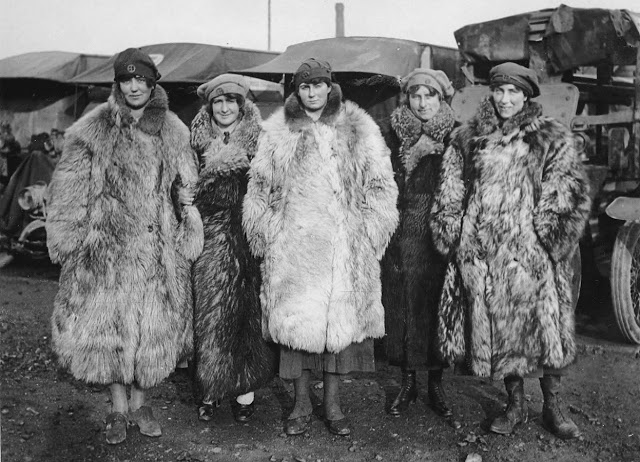 Dressed in a rather exotic uniform of army boots, army caps and fur coats, this image shows five female members of the First Aid Nursing Yeomanry standing in front of some Red Cross ambulances. As the first female recruits of this organization came from the ranks of the upper classes, perhaps the fur coats should not be too surprising. The women would have worked as drivers, nurses and cooks. Established by Lord Kitchener in 1907, the First Aid Nursing Yeomanry (FANY) was initially an auxiliary unit of women nurses on horseback, who linked the military field hospitals with the frontline troops. Serving in dangerous forward areas, by the end of the conflict First Aid Nursing Yeomanry members had been awarded 17 Military Medals, 1 Legion d'Honneur and 27 Croix de Guerre. A memorial to those women who lost their lives while working for the organization, can be found at St Paul's Church, Knightsbridge, London. (National Library of Scotland)