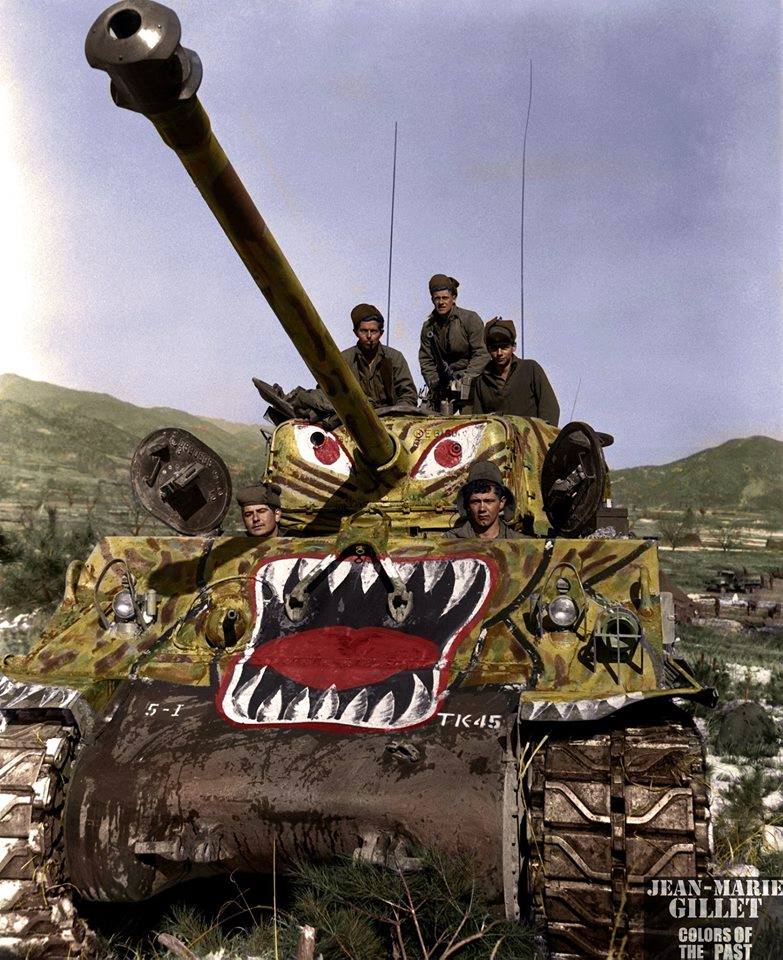 US soldiers prepare to advance along the Han River area, Korea, in their M-4A3E8 Sherman tank (painted with a 'tiger scheme' as a psychological effort to undermine Chinese morale), during the offensive launched by the 5th Regimental Combat Team against the Chinese forces in that area. February 18th 1951. #Koreanwar #Shermantank Left to Right: Cpl John T. Clark (Union, SC); Cpl James E. Kishbaugh (Nescopeck, PA); Sgt Frank C. Allen (Etiwanda, CA); Sgt Theodore R. Liberty (Bushton, MA); and Cpl William J. Bohmback (Boston, MA).  'Operation Courageous' (22-28 March 1951) was a military operation performed by the United States Army during the Korean War designed to trap large numbers of Chinese and North Korean troops between the Han and Imjin Rivers north of Seoul, opposite the South Korean I Corps. The intent of Operation Courageous was for I Corps, which was composed of the U.S. 25th and 3rd Infantry Divisions and the Republic of Korea (ROK) 1st Infantry Division, to advance quickly on the North Korean and Chinese troops and reach the Imjin River with all possible speed. Source: US Army - Department of Defense visual information (DVIC) (Colorised by Jean Marie Gillet from France) https://www.facebook.com/colors.of.the.past 