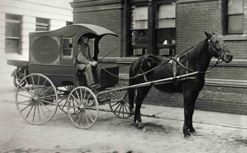 This is an image of a city collection mail wagon on an unidentified city street, used to collect mail from sidewalk mailboxes. 1905