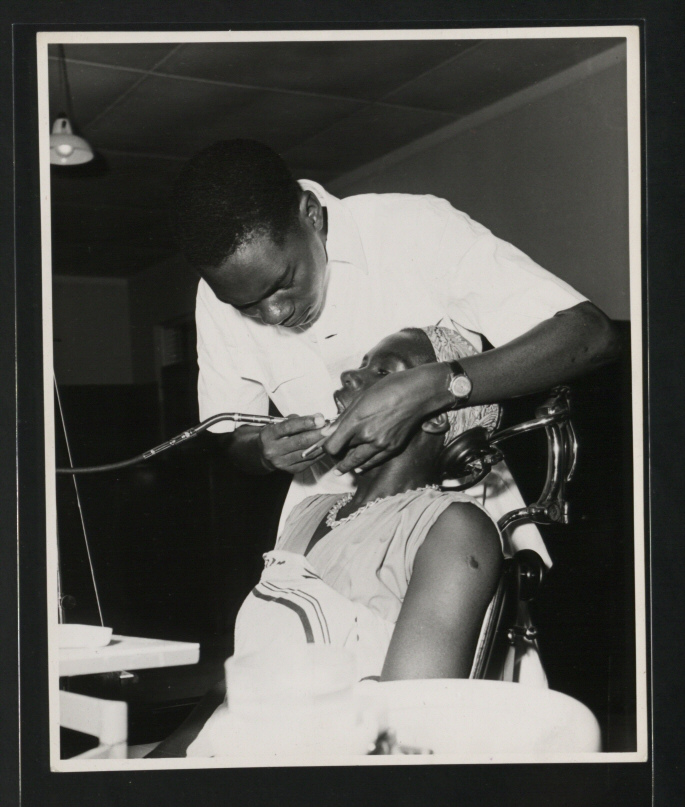 A Dental Assistant attends a patient at the Dental Unit, Princess Margaret Hospital, Dar es Salaam.