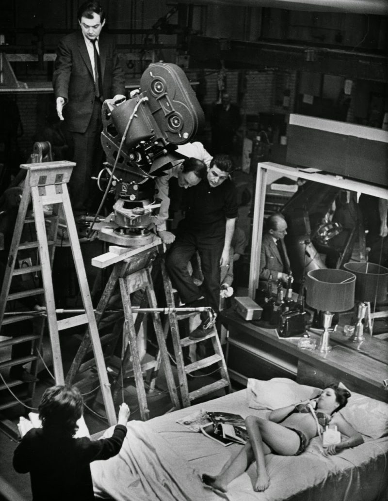 Framing a high-angle shot of Tracy Reed (playing Miss Scott) in Turgidson’s bed.