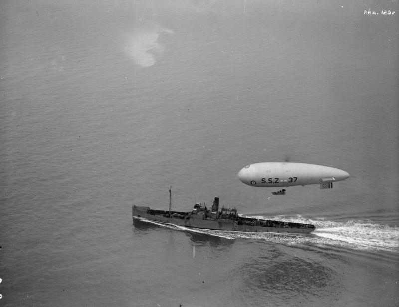 An SSZ airship escorts a Royal Navy sloop.