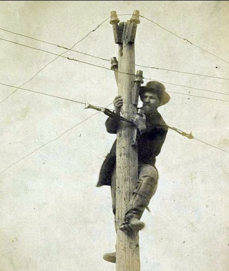 A repairman in 1863 working on a telegraph line 