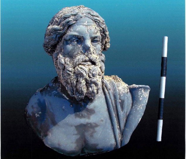 A undated photo showing what is alleged to be a Diorite bust of an unidentified person with long hair which some believe that it could belong to the Nile god Hapy. The bust is one of the thousand of distinguished artifacts dated back to the third and fifth centuries BC., that have been discovered early last week by French underwater archaeologists during their recent survey at Hercules temple found within the walls of the submerged ancient port city of Heracleion. source