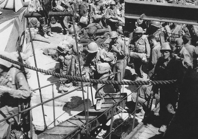 Official U.S. Army photograph, taken a Pozzuoli near Naples in August 1944, that happened to capture Private First Class Steve Weiss boarding a British landing craft. He is climbing the gangplank on the right-hand side of the photograph.