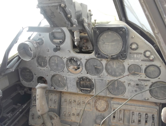The cockpit is in remarkable though dusty condition. Perhaps an experienced Kittyhawk pilot would be able to gain more information about the crash from the settings here. Photo: Jakub Perka