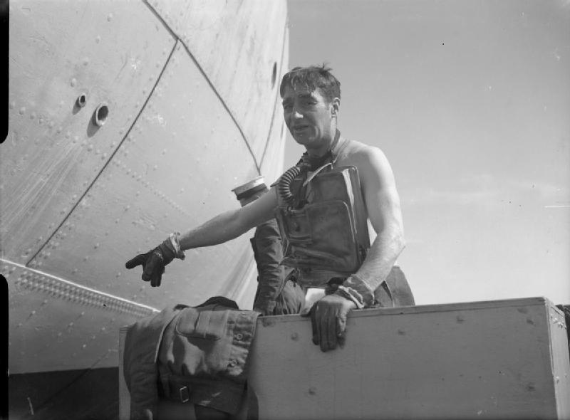 The Royal Navy during the Second World War At Gibraltar, Lieutenant in Charge, Lieutenant Lionel Crabbe, RNVR of the Underwater Working Party wearing some of his diving gear.