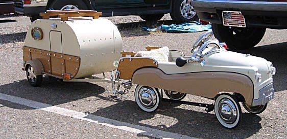 Pedal car with its own trailer. source