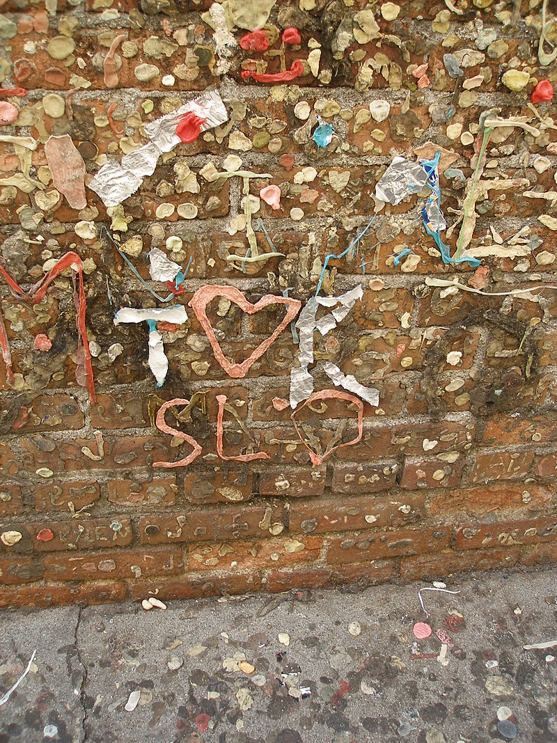 Gum wrappers and foil also decorate the walls occasionally spelling out letters and words on the wall. source