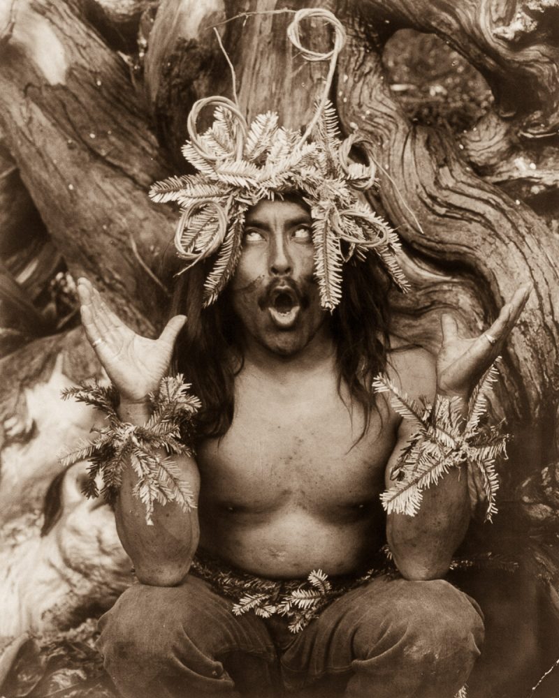 A Kwakiutl shaman performs a religious ritual. 1914