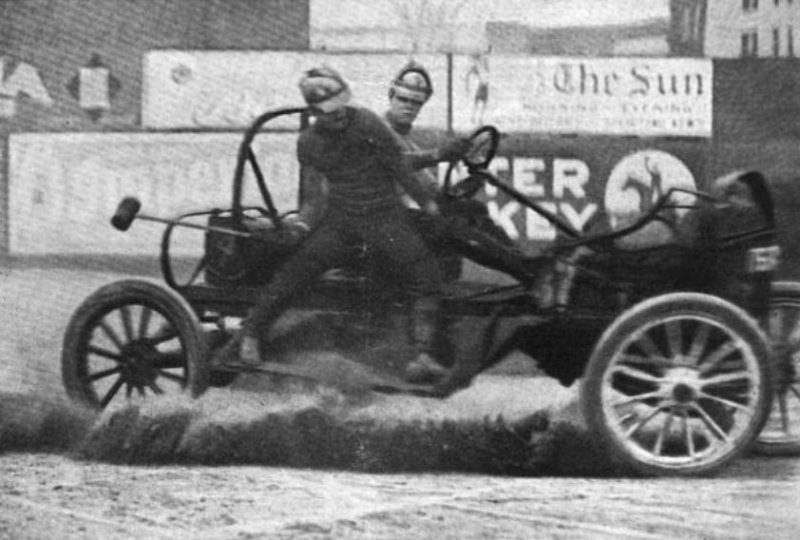 A mallet man balances on the side of a moving auto polo car during a match in 1913 in a photograph by the International News Service. source