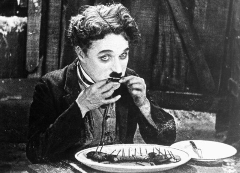 Chaplin eating the shoe in Gold Rush.Source