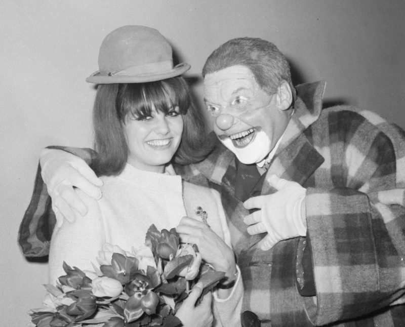 Claudia Cardinale with a clown Source