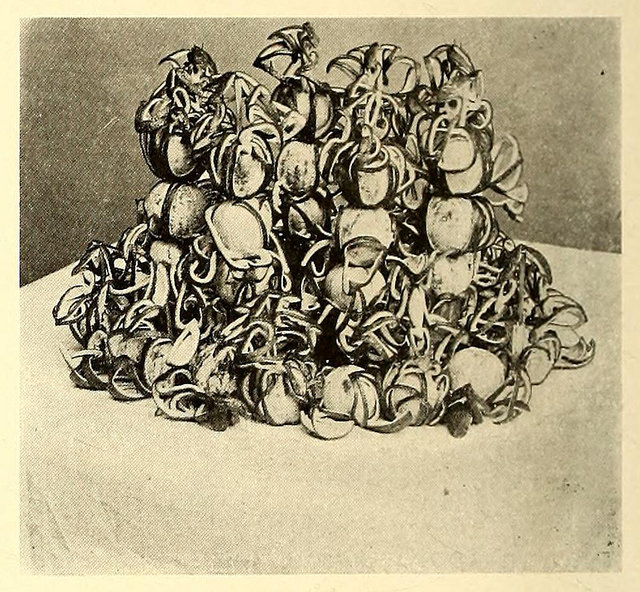 Fig. 14 shows another table decoration in a manner similar to the preceding design but massed in greater form.