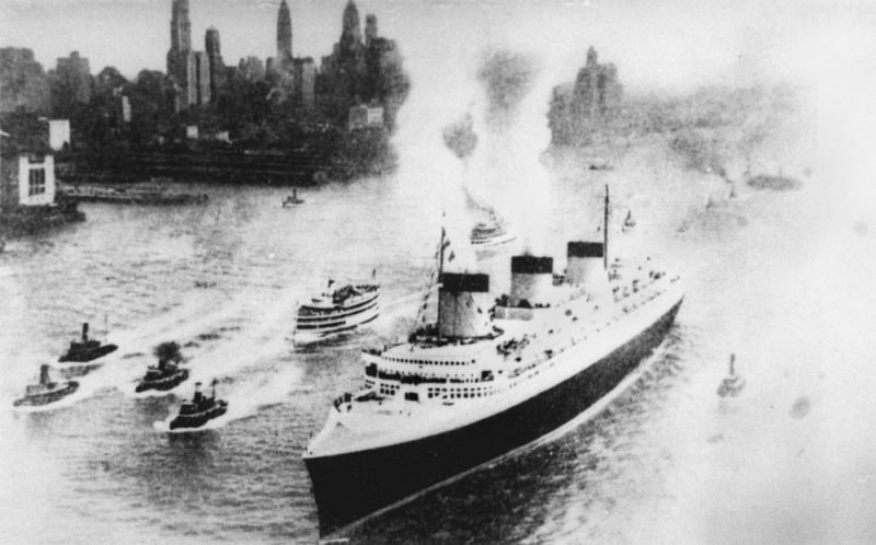 Normandie arriving in New York, at the end of her record – breaking maiden voyage. source