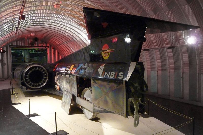 Rear view of ThrustSSC, with a panel removed to show one of the aluminium alloy wheels, at Coventry Transport Museum. source