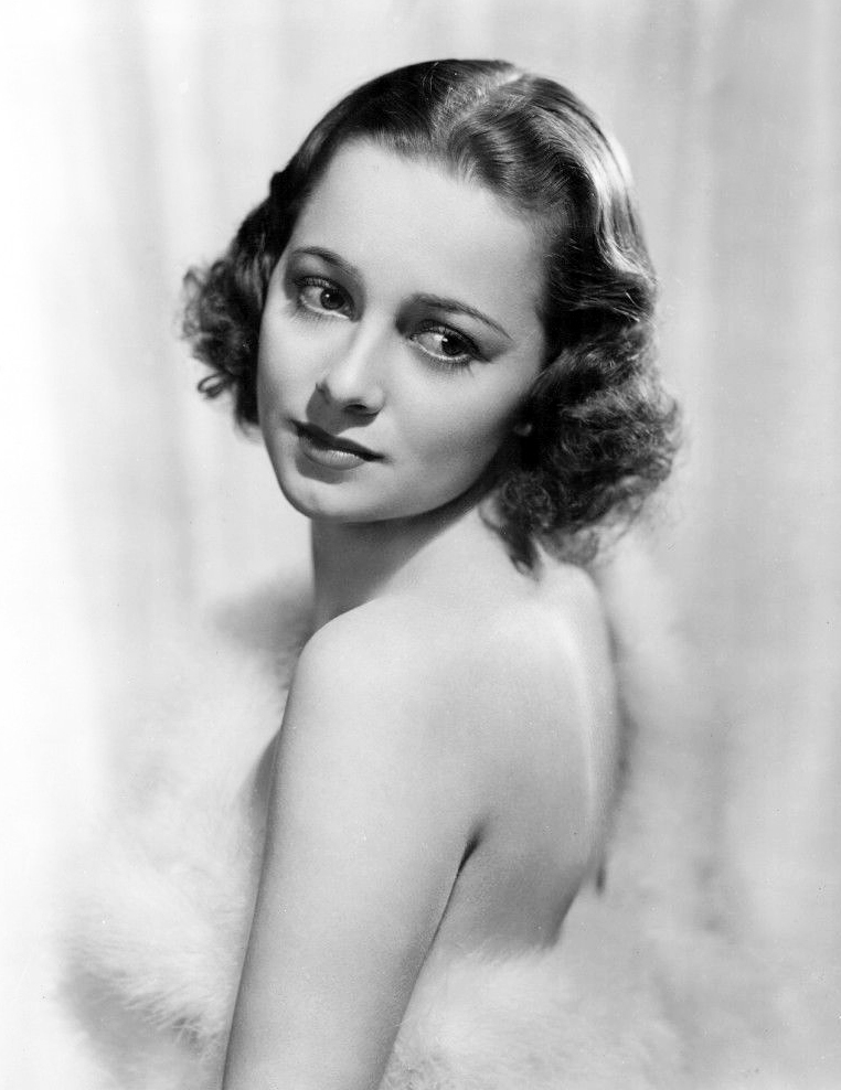 Studio publicity photo of Olivia de Havilland Source