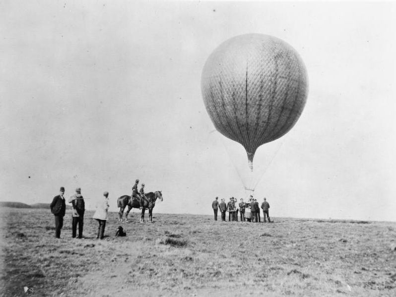 Aviation in Britain Before the First World War. Several soldiers of the Royal Engineers (balloon section) stood around the basket of an observation balloon whilst two more are sat on their horses watching. The balloon appears to have a female passenger. (Pre-1914) . source