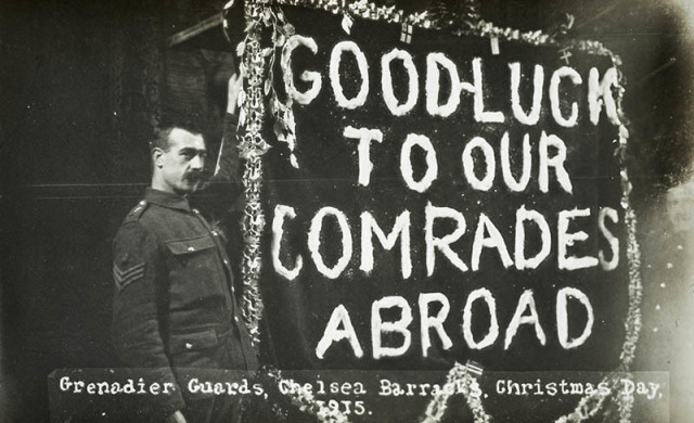 A Grenadier Guard with a poignant banner at Chelsea Barracks, Christmas Day, 1915.