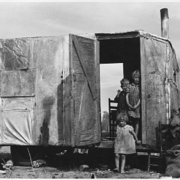 A migratory family from Texas living in a trailer in an Arizona cotton field .Source