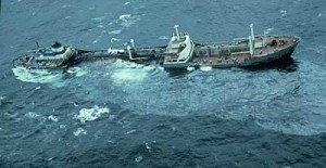 Argo Merchant, aground southeast of Nantucket seen with a silvery oil slick coming from her center holds. source