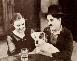 Still from the American comedy film A Dog's Life (1918) with Edna Purviance and Charlie Chaplin, on page 22 of the April 13, 1918 Exhibitors Herald. Source