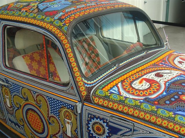 Volkswagen Beetle covered in beads – the Vochol. Photo by Museo de Arte Popular CC BY 3.0