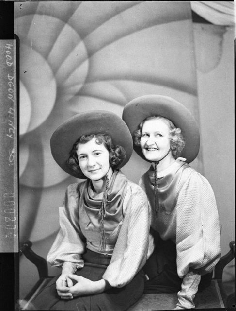Everything is matching, the hats, the outfit, the hairstyle. A photo of Mrs. Cracknell and Mitzi.