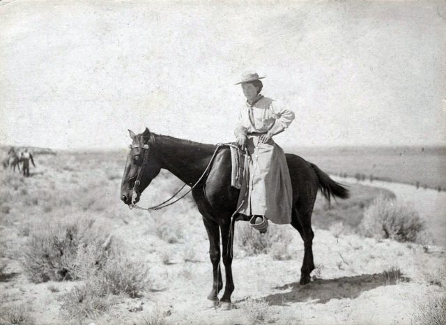 This is likely a photo of American painter Minerva Teichert riding a horse.