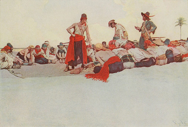 Treasure being divided among pirates in an illustration by Howard Pyle.