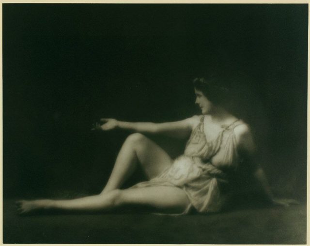 Isadora Duncan in a Greek-inspired pose and wearing her signature Greek tunic.