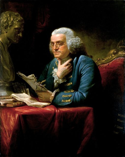 Benjamin Franklin in London, 1767, wearing a blue suit with elaborate gold braid and buttons, a far cry from the simple dress he affected at the French court in later years. Painting by David Martin, displayed in the White House.