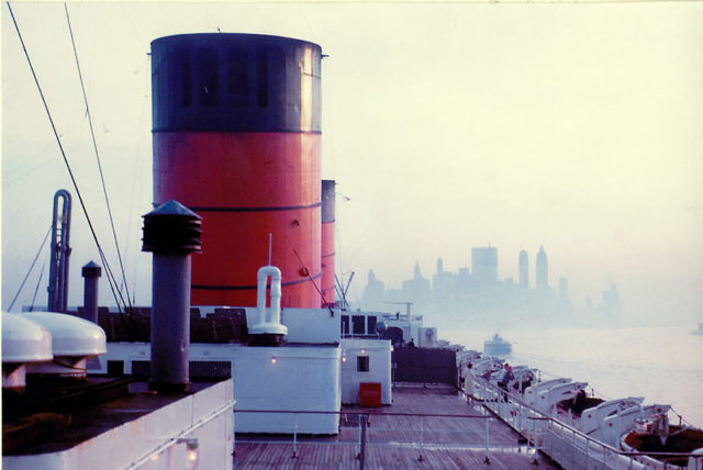 RMS Queen Elizabeth entering New York harbor in 1965, taken from the boat deck, early morning. Photo by Jongleur100 CC BY 3.0