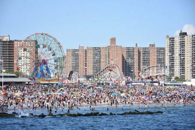 Coney Island beach, amusement park, and high rises as seen from the pier in June 2016. Photo by MusikAnimal CC BY SA 4.0