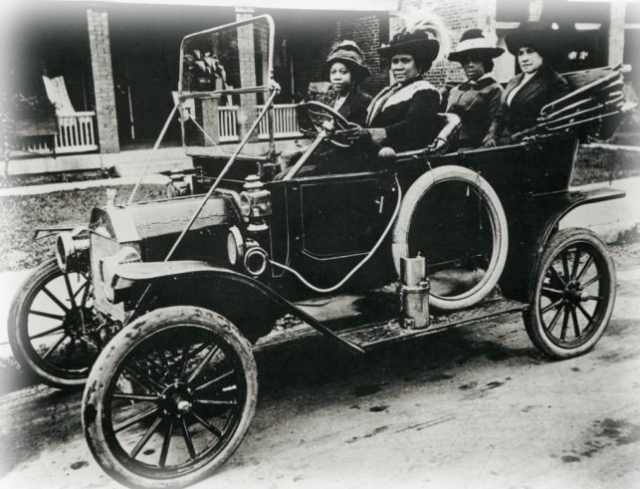 Madam Walker and several friends in her automobile.