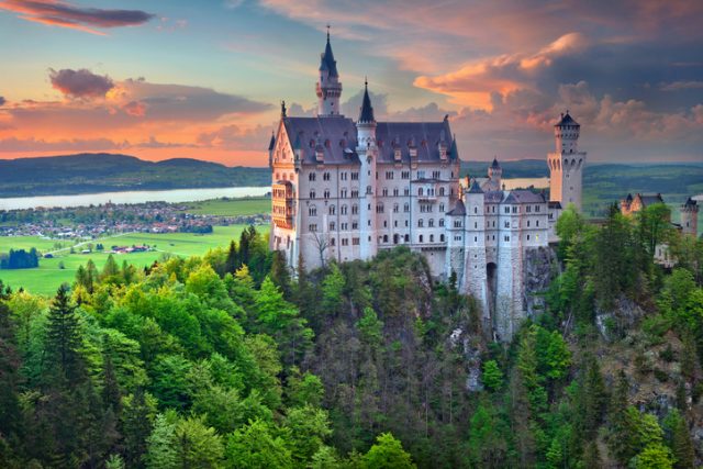 Hohenschwangau, Germany – May 9, 2015: view of Neuschwanstein Castle near Hohenschwangau, Germany during spring afternoon surrounded by spring colours.