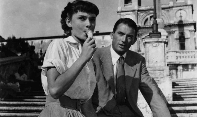 Audrey Hepburn eats gelato with Gregory Peck in a scene from the film ‘Roman Holiday’ (1953). Photo by Paramount/Getty Images