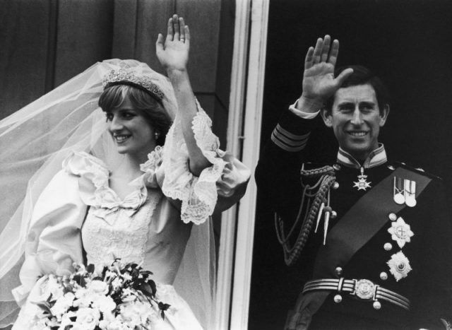 Prince of Wales and Diana, Princess of Wales (1961 – 1997), waving to crowds from the balcony of Buckingham Palace, London after their wedding. (Photo by Fox Photos/Getty Images)