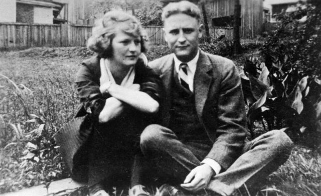 American novelist Francis Scott Key Fitzgerald (1896-1940) and wife Zelda sitting outside on lawn at her mother’s home. Photo by Time Life Pictures/Mansell/The LIFE Picture Collection/Getty Images
