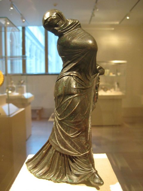 Greek bronze statuette of a veiled and masked dancer, 2nd–3rd century BC. Photo by: Claire H. – CC BY-SA 2.0