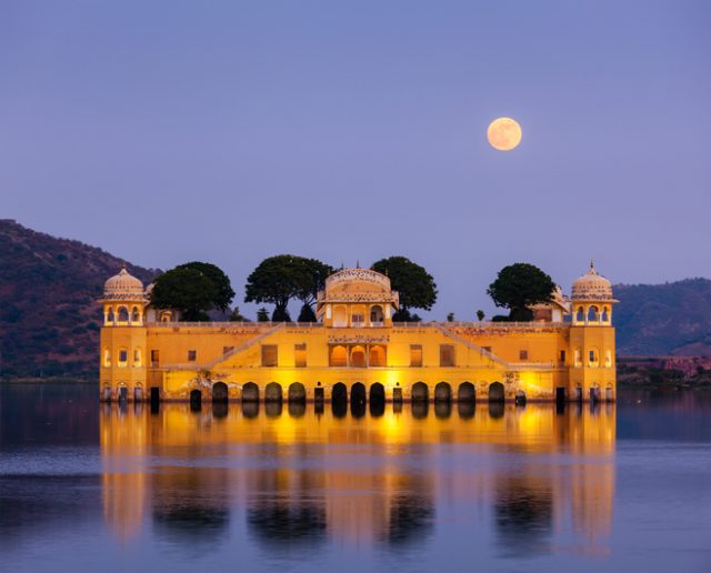 Rajasthan landmark – Jal Mahal (Water Palace) on Man Sagar Lake in the evening in twilight. Jaipur, Rajasthan, India
