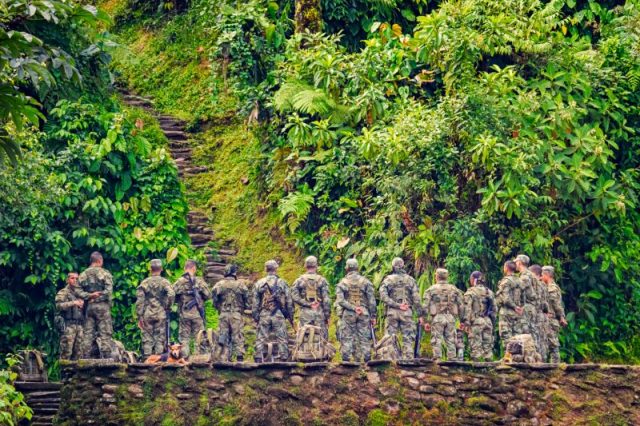 Group of Colombian soldiers listen to instructions at Ciudad Perdida in the jungles of the Colombian highlands.