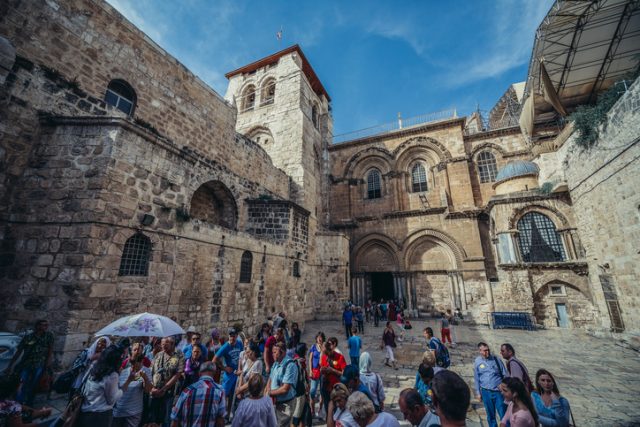 Jerusalem, Israel – October 22, 2015. Group of tourists in front of Church of the Holy Sepulchre located in Christian Quarter