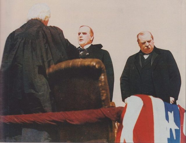 Chief Justice Melville Fuller swears in William McKinley as president; outgoing President Grover Cleveland at right.